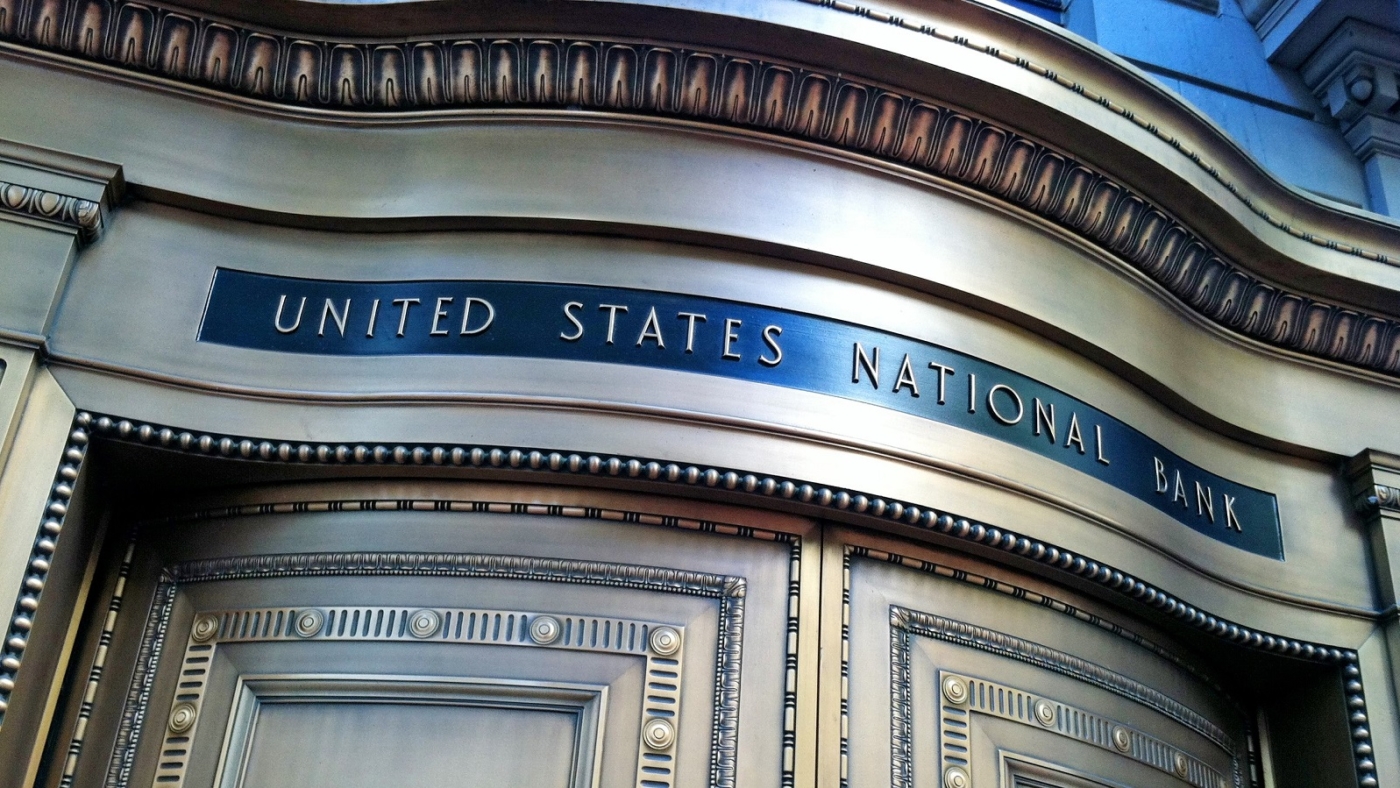 Portland, OR, USA - October 5, 2013: The entrance to the United States National Bank building in Portland, OR.. Built in 1917, the bronze door entrance was designed by Arvard Fairbanks.